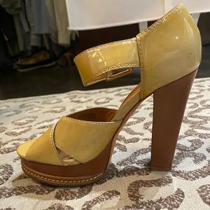 Kors Michael kors pumps with buckle strap at ankle.